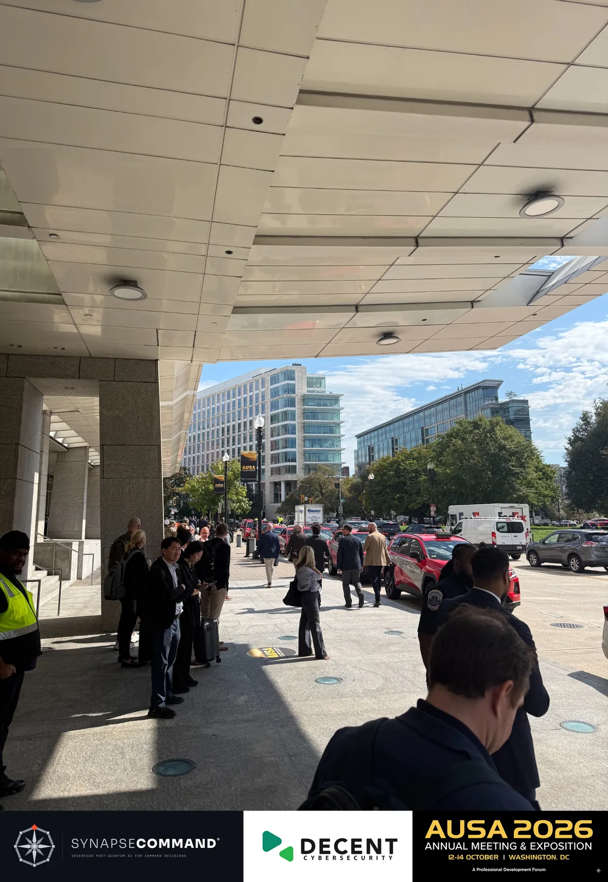 Attendees outside the convention venue in Washington, D.C., with an AUSA street banner.